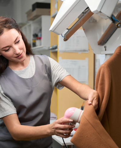 a girl dry cleaning clothes